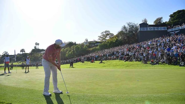Jon Rahm putts on the 18th green in the final round of the 2023 Genesis Invitational.